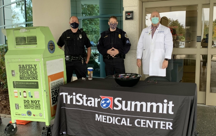 Medical staff from HCA Healthcare facilities partnering with law enforcement to collect unused pain medication in October 2020's #CrushTheCrisis event.