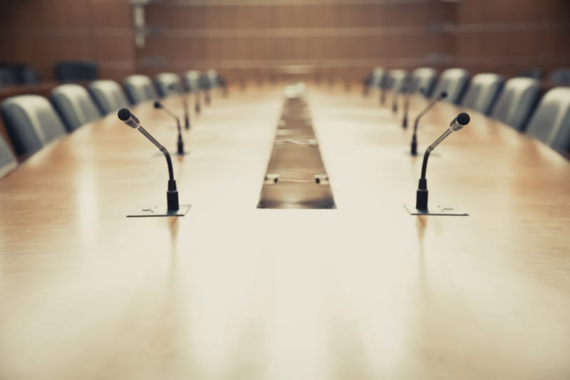 Empty boardroom table. Who will get a seat in ESG discussions?