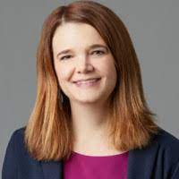 Laura Nicole Dyer, compliance leader, smiles looking to camera.